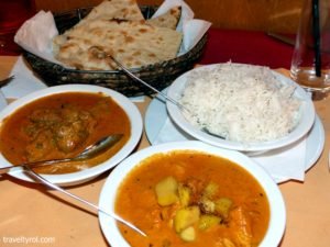 Dishes served with rice and naan bread at Himal, one of the best Innsbruck Restaurants.