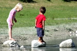 Kids playing in Klaus Äuele Kid's Park in the Stubai Valley in Tyrol, Austria.