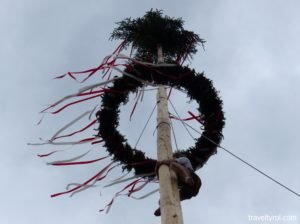 Climber on Maypole in Austria.