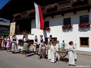 Children and women in Fronleichnam procession in Tulfes.