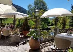 Summer seating area in garden setting at Martin's Bistro.